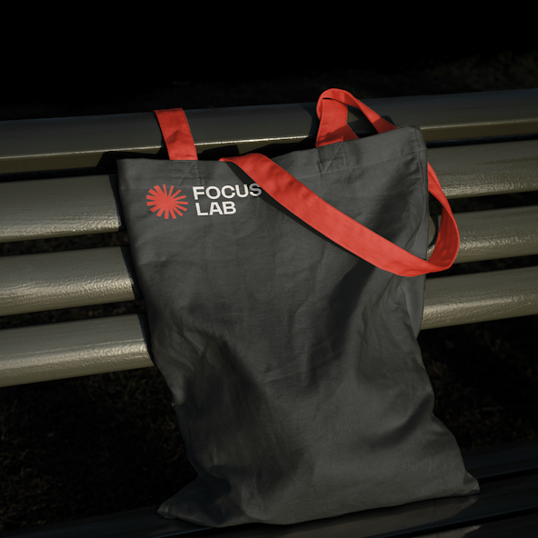 A black tote bag with red straps