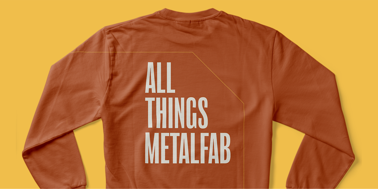 Orange sweatshirt that reads "All Things Metalfab"