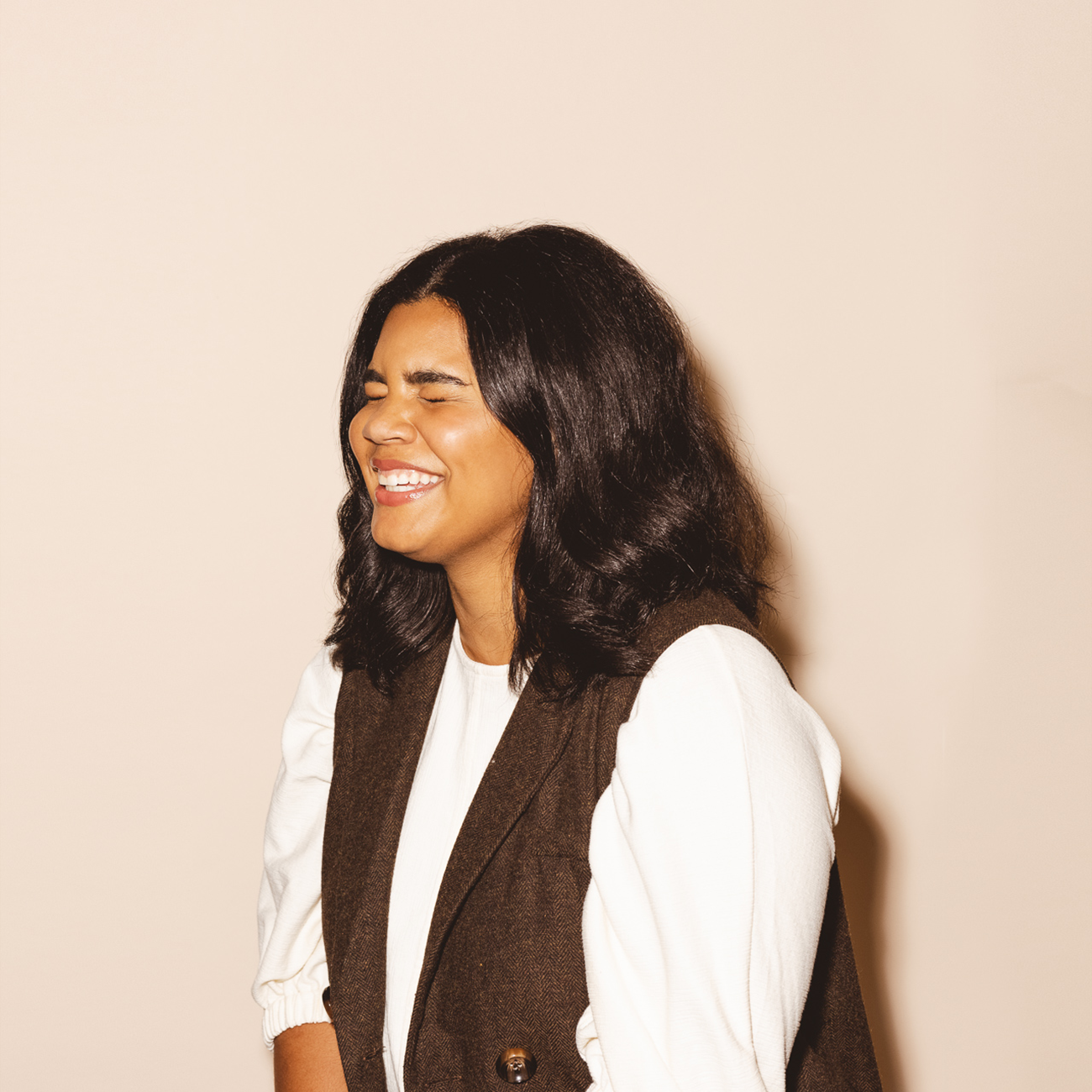 Headshot style for Salesloft. A woman laughing